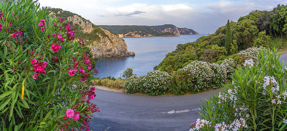 View of coastline from Monastery of Paleokastritsa at sunset, Palaiokastritsa, Corfu, Ionian Sea, Greek Islands, Greece, Europe