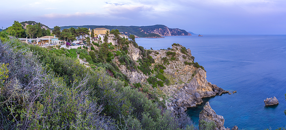 View of coastline from Monastery of Paleokastritsa at sunset, Palaiokastritsa, Corfu, Ionian Sea, Greek Islands, Greece, Europe