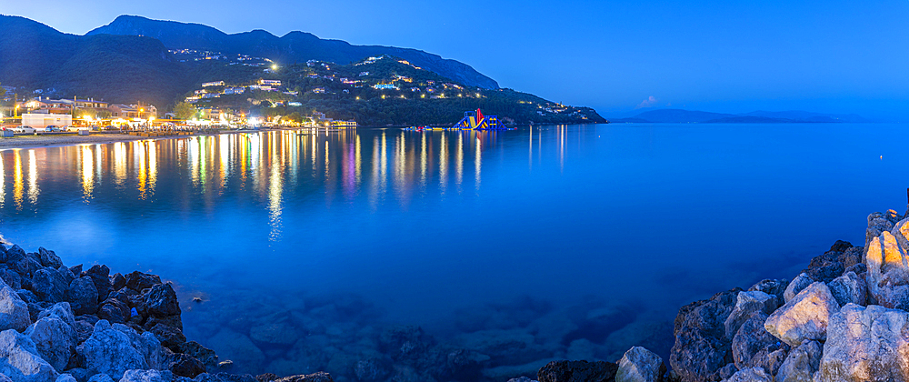 View of Ionian Sea and Ipsos Beach in Ipsos at dusk, Ipsos, Corfu, Ionian Sea, Greek Islands, Greece, Europe