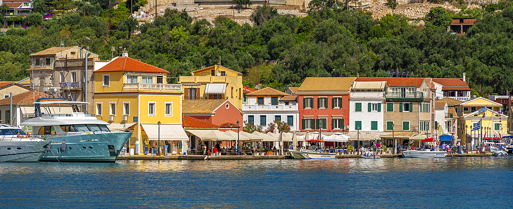 View of boats and colourful buildings in the harbour in Gaios Town, Paxos, Ionian Sea, Greek Islands, Greece, Europe