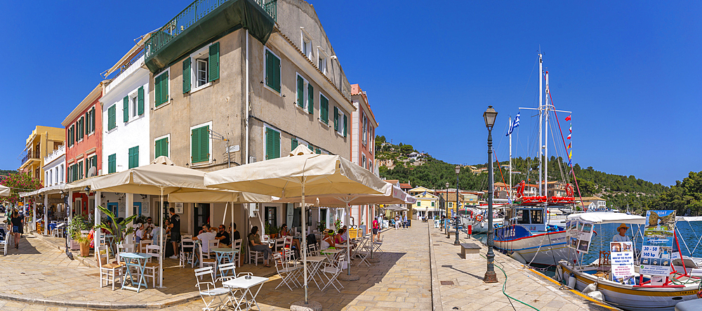 View of boats and cafes in the harbour in Gaios Town, Paxos, Ionian Sea, Greek Islands, Greece, Europe