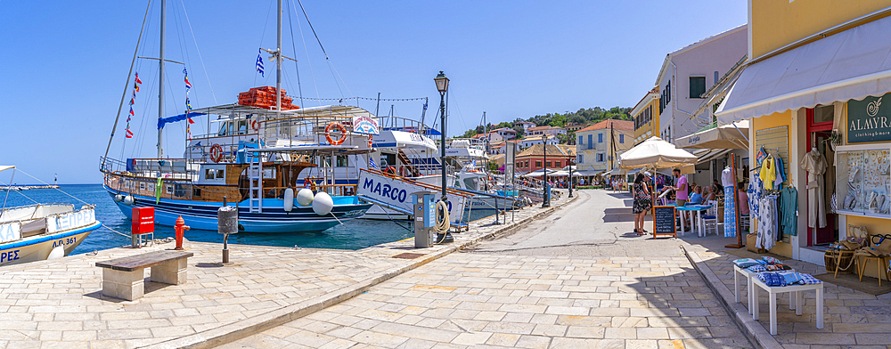 View of boats and cafes in the harbour in Gaios Town, Paxos, Ionian Sea, Greek Islands, Greece, Europe