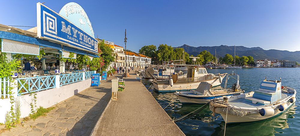 View of restaurant, boats and harbour in Thassos Town, Thassos, Aegean Sea, Greek Islands, Greece, Europe