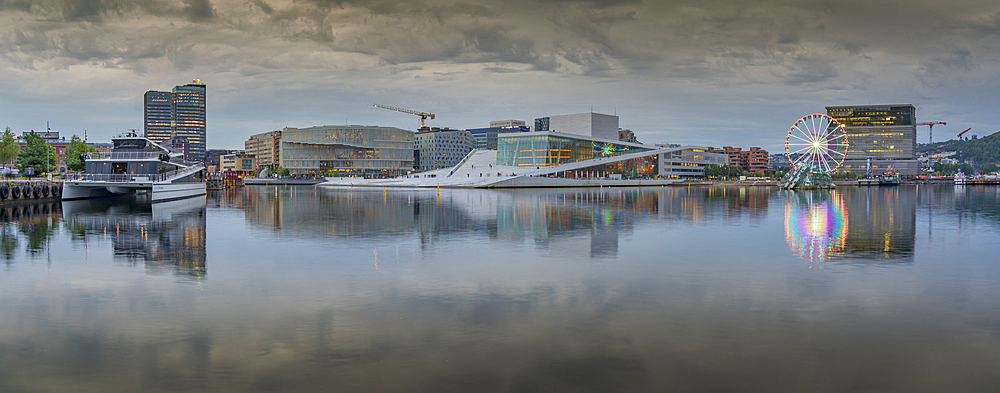 View of Oslo Opera House and Munch Museum reflecting in harbour on cloudy day, Oslo, Norway, Scandinavia, Europe