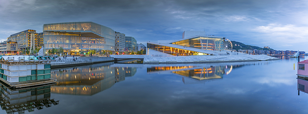 View of Public Library and Oslo Opera House reflecting in harbour on cloudy evening, Oslo, Norway, Scandinavia, Europe