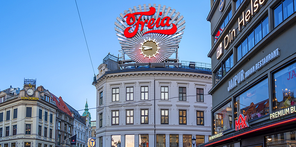 View of neon lights and architecture on Karl Johans Gate at dusk, Oslo, Norway, Scandinavia, Europe