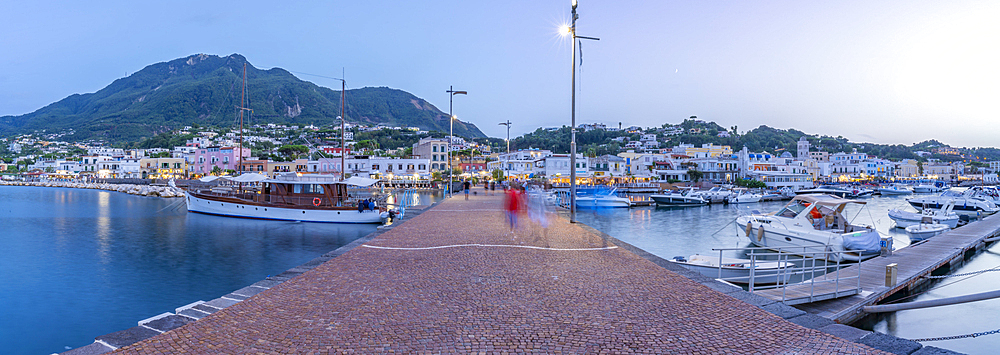 View of harbour and town of Lacco Ameno at dusk, Island of Ischia, Campania, Italy, Europe