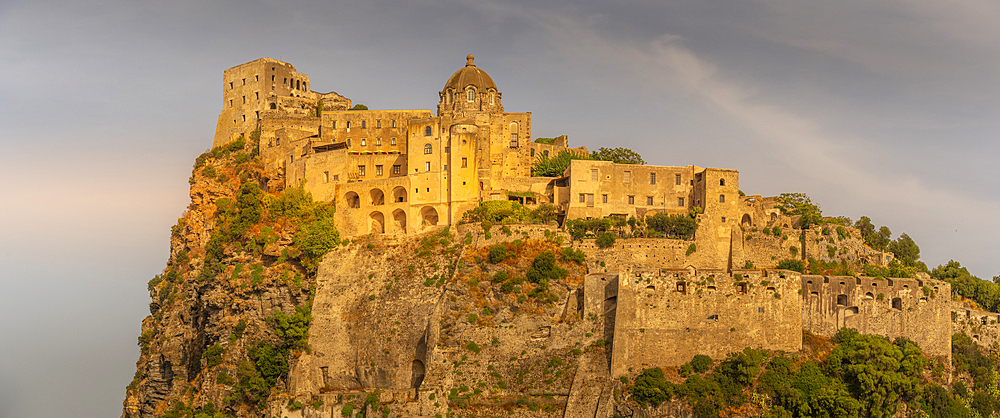 View of Aragonese Castle at sunset, Port of Ischia, Island of Ischia, Campania, Italy, Europe