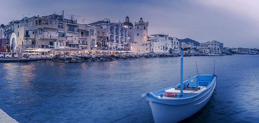 View of Duomo di Santa Maria Assunta and coastline at dusk, Port of Ischia, Island of Ischia, Campania, Italy, Europe