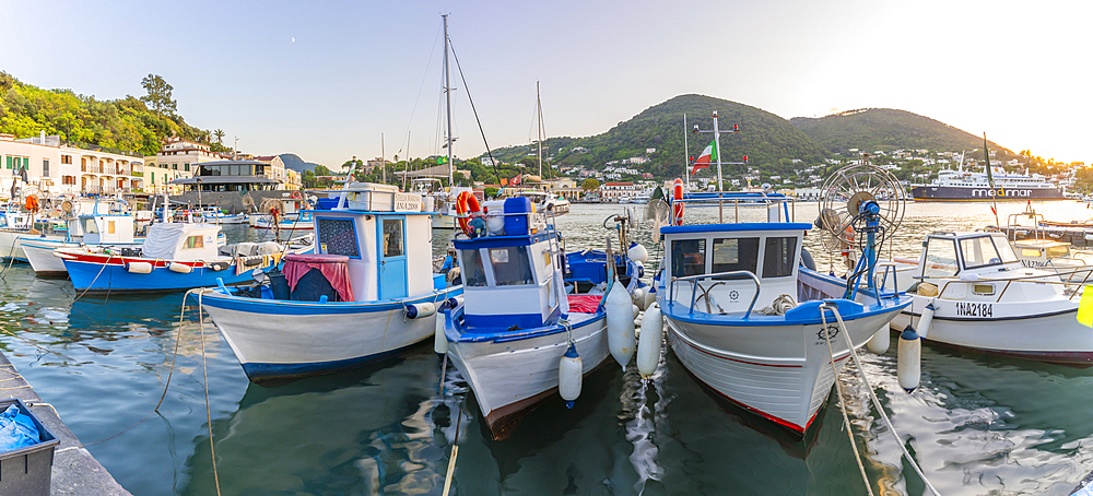 View of fishing boats in Porto d'Ischia at sunset, Port of Ischia, Island of Ischia, Campania, Italy, Europe