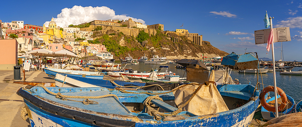 View of boats in Marina di Corricella and Eglise Santa Maria delle Grazie in background, Procida, Phlegraean Islands, Gulf of Naples, Campania, Southern Italy, Italy, Europe