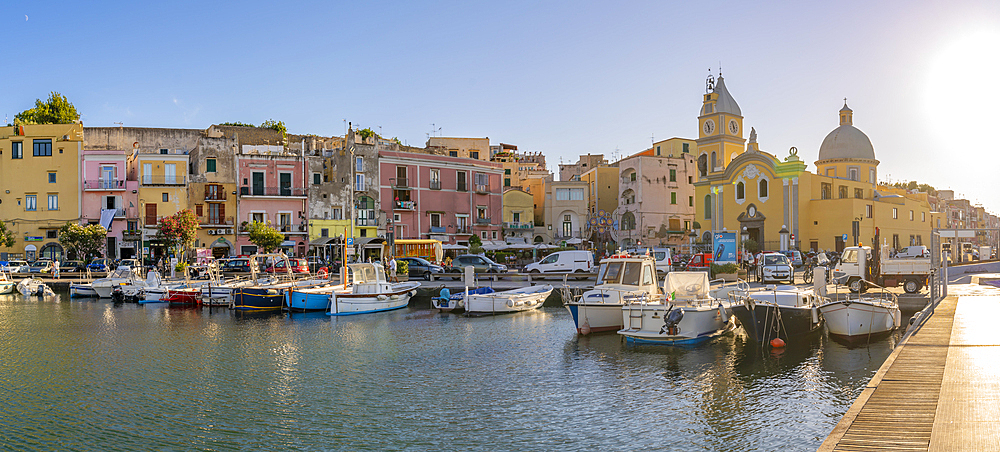 View of Church Madonna delle Grazie in the fishing port Marina Grande with boats at golden hour, Procida, Phlegraean Islands, Gulf of Naples, Campania, Southern Italy, Italy, Europe