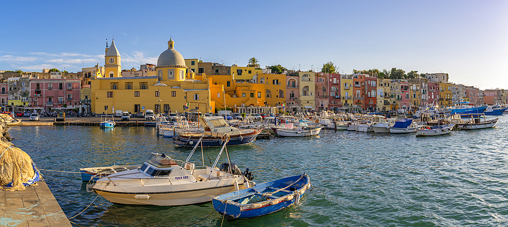 View of Church Madonna delle Grazie in the fishing port Marina Grande with boats at golden hour, Procida, Phlegraean Islands, Gulf of Naples, Campania, Southern Italy, Italy, Europe