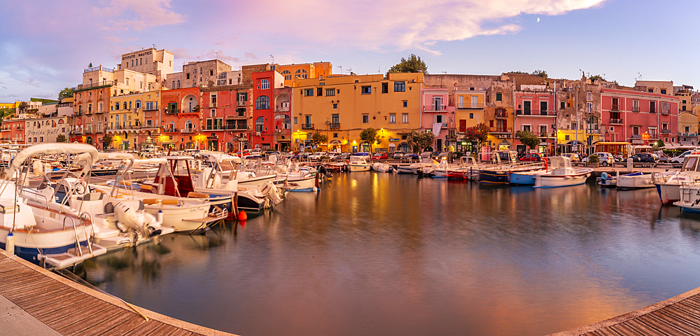 View of the fishing port Marina Grande with boats at golden hour, Procida, Phlegraean Islands, Gulf of Naples, Campania, Southern Italy, Italy, Europe