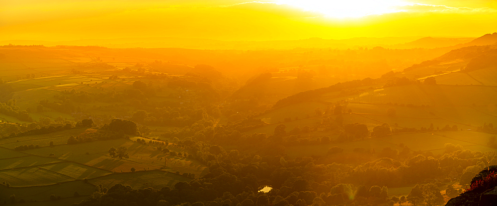 View of landscape from Curbar Edge at sunset, Peak District National Park, Baslow, Derbyshire, England, United Kingdom, Europe