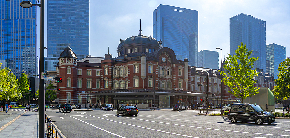 View of Tokyo Station and Chiyoda's Marunouchi business district backdrop on a sunny day, Chiyoda, Tokyo, Honshu, Japan