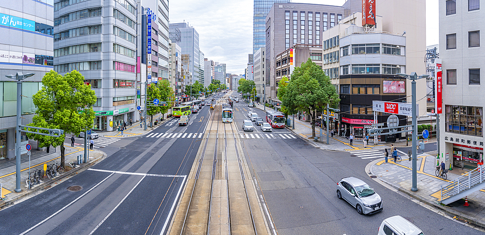 Elevated view of traffic and tram on major street during daytime, Hondori, Naka Ward, Hiroshima, Honshu, Japan