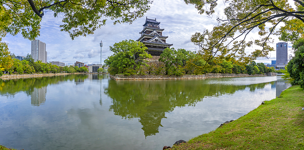 View of Hiroshima Castle, with museum, reflecting in Moat, Motomachi, Naka Ward, Hiroshima, Japan, Asia