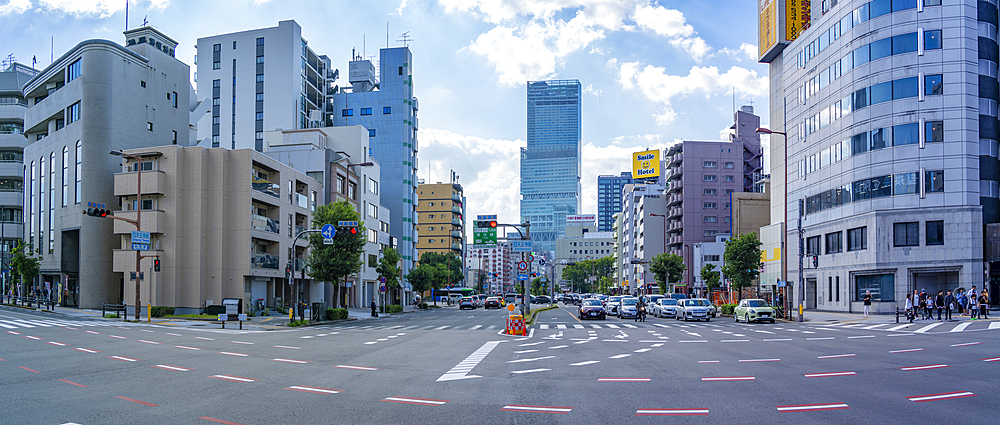 View of street scene and temple in the Shinsekai area, Osaka, Honshu, Japan