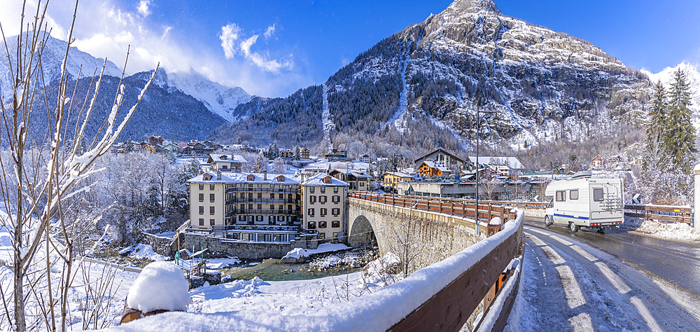 View of snow covered trees, mountains and Dolonne from Courmayeur during winter, Courmayeur, Aosta Valley, Italy, Europe