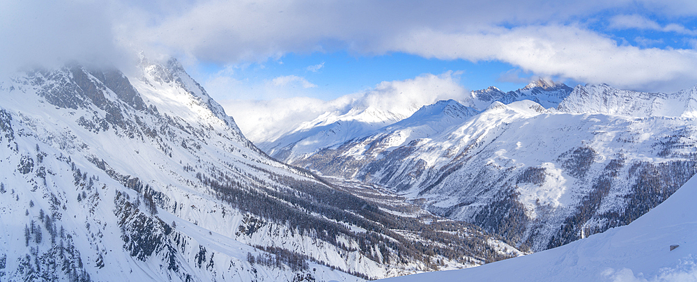 View of snow covered Aosta Valley and mountains from Pavillon du Mont Fréty in winter, Courmayeur, Aosta Valley, Italy, Europe