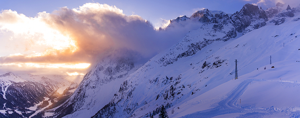 View of snow covered Aosta Valley and mountains from Pavillon du Mont Fréty in winter, Courmayeur, Aosta Valley, Italy, Europe