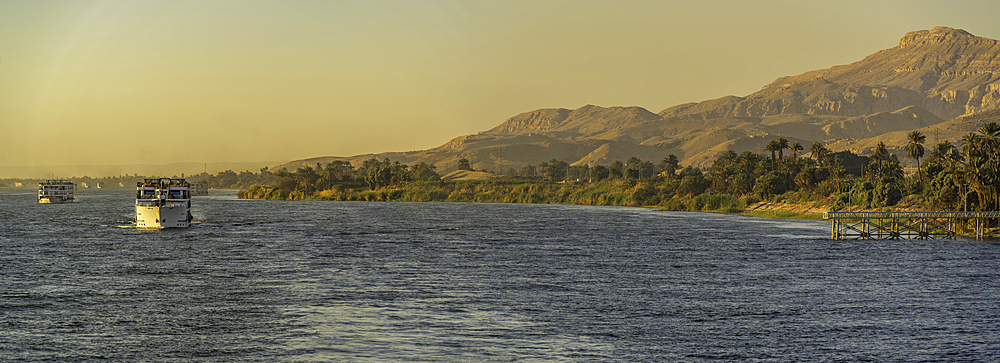 View of cruise boats from cruise boat near Al Dababia on the Nile River, Luxor, Egypt, Africa