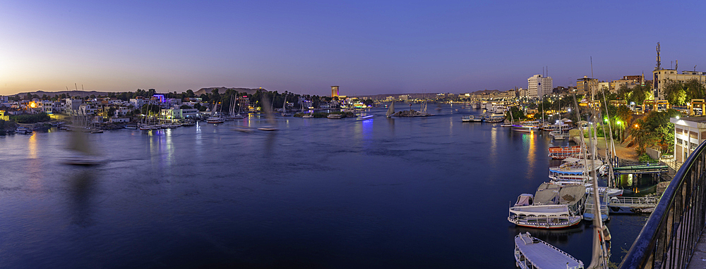 View of fellucas on the Nile river from Feryal Garden at dusk, Aswan, Nubia, Egypt, North Africa, Africa