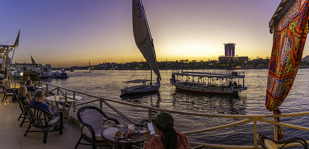 View of fellucas on the Nile river at dusk, Aswan, Nubia, Egypt, North Africa, Africa