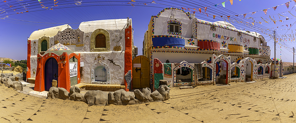 View of colourful architecture at Nagaa Suhayl Gharb on the Nile river near Aswan, Aswan, Nubia, Egypt, North Africa, Africa