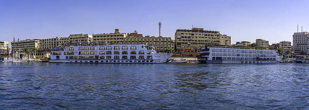 View of cruise boats on the Nile river from small boat in Aswan, Aswan, Nubia, Egypt, North Africa, Africa
