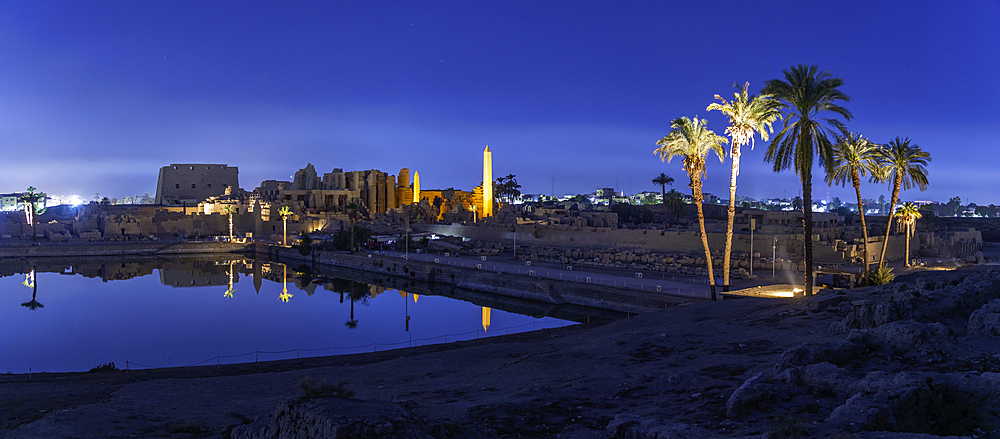 View of Karnak Temple sound and light show at dusk, Luxor, Egypt, Africa