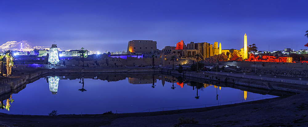 View of Karnak Temple sound and light show at dusk, Luxor, Egypt, Africa