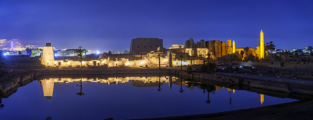 View of Karnak Temple sound and light show at dusk, Luxor, Egypt, Africa
