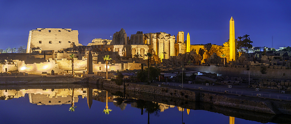 View of Karnak Temple sound and light show at dusk, Luxor, Egypt, Africa