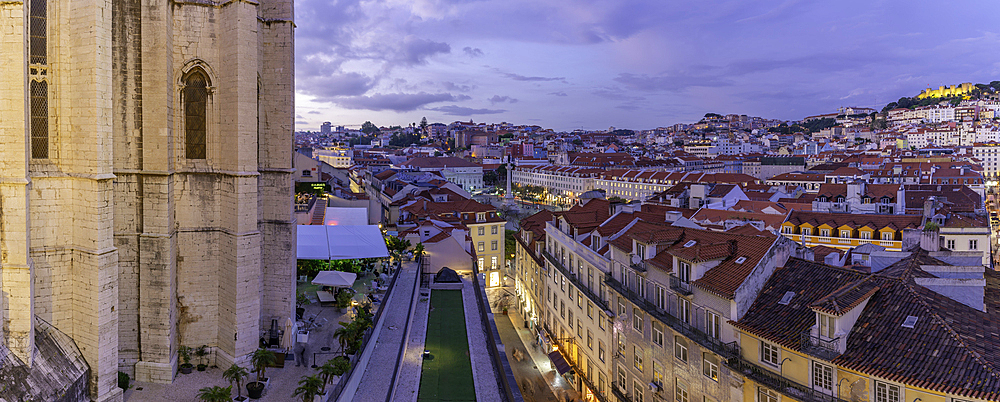 View of city rooftops and Carmo Archaeological Museum from Santa Justa Lift at sunset, Lisbon, Portugal, Europe
