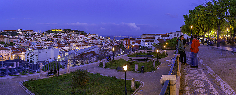 View of Lisbon from Miradouro de Sao Pedro de Alcantara at dusk, Lisbon, Portugal, Europe