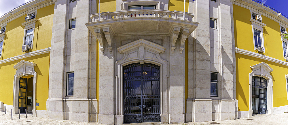 View of yellow and stone architecture of the Ministry of Finances on a sunny day, Lisbon, Portugal, Europe
