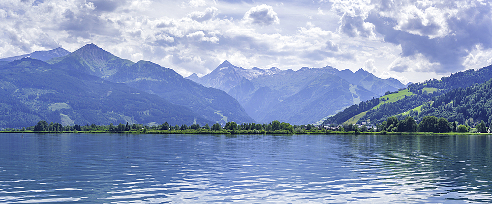 View of mountains and Lake Zell from cruise boat on a sunny day, Zell am See, Salzburg, Austria, Europe