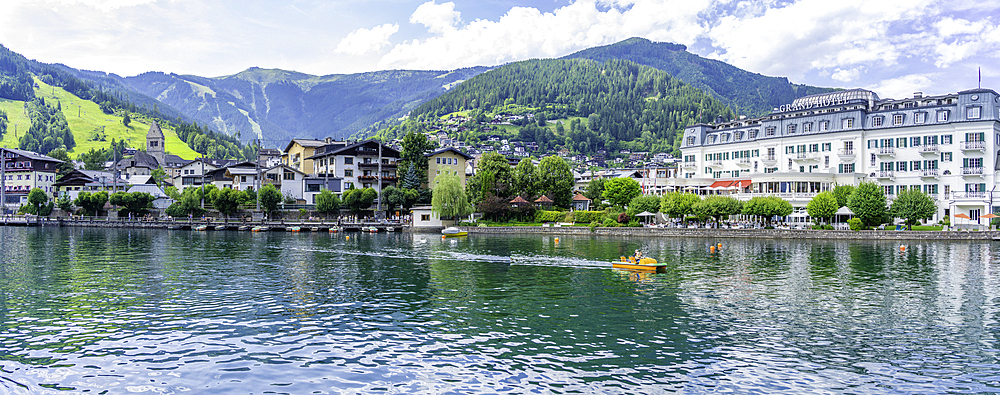 View of the Grand Hotel and Lake Zell from cruise boat on a sunny day, Zell am See, Salzburg, Austria, Europe