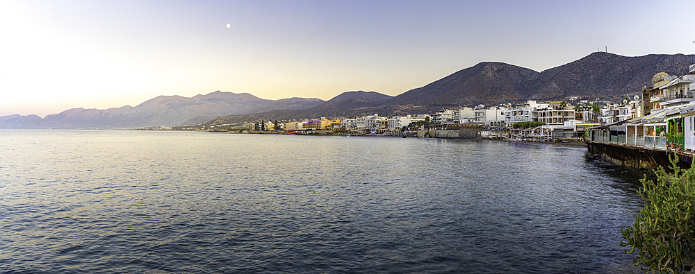 View of coastline and Paralia Limena Chersonisou Beach in Limenas Chersonisou during golden hour, Crete, Greek Islands, Greece, Europe