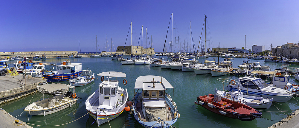 View of Koules Venetian Fortress and boats in Heraklion Venetian Port on a sunny day, City of Heraklion, Crete, Greek Islands, Geece, Europe