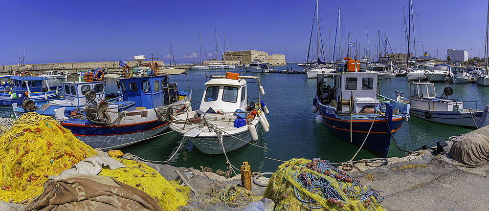 View of Koules Venetian Fortress and boats in Heraklion Venetian Port on a sunny day, City of Heraklion, Crete, Greek Islands, Geece, Europe