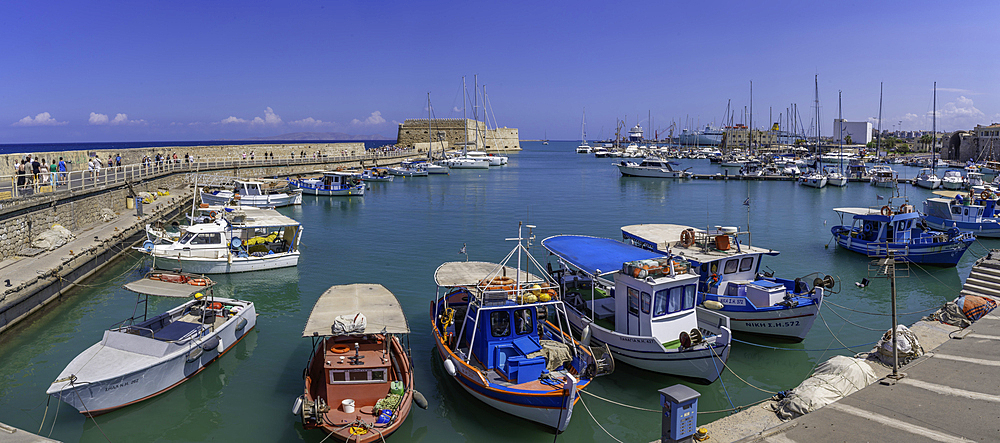 View of Koules Venetian Fortress and boats in Heraklion Venetian Port on a sunny day, City of Heraklion, Crete, Greek Islands, Geece, Europe