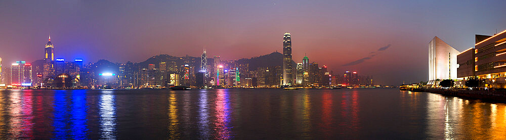 View over Victoria harbour to Hong Kong Island and The Peak at dusk, Hong Kong, China, Asia