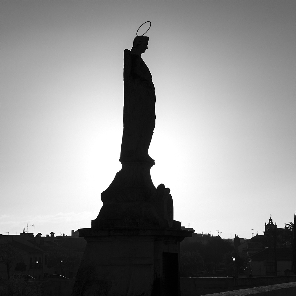 Silhouette of a statue, Roman bridge of Cordoba, Cordoba, Andalusia, Spain