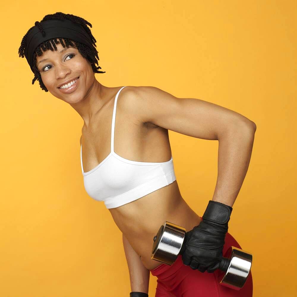 African woman lifting weights