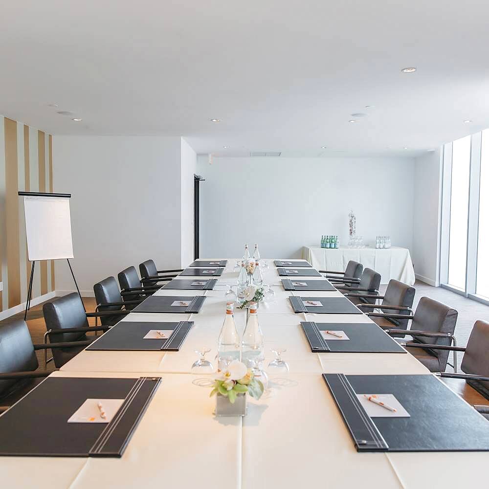 Empty meeting table in conference room