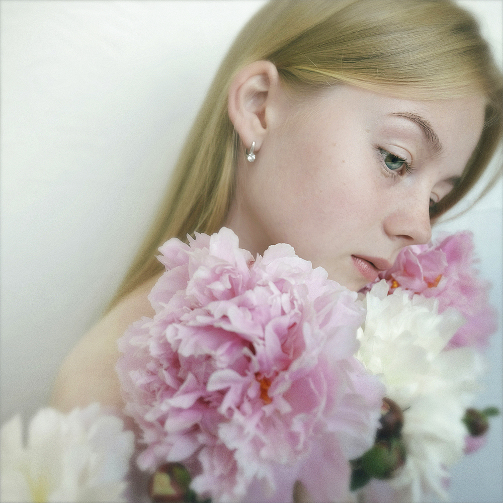 Close up of Caucasian teenage girl holding flowers