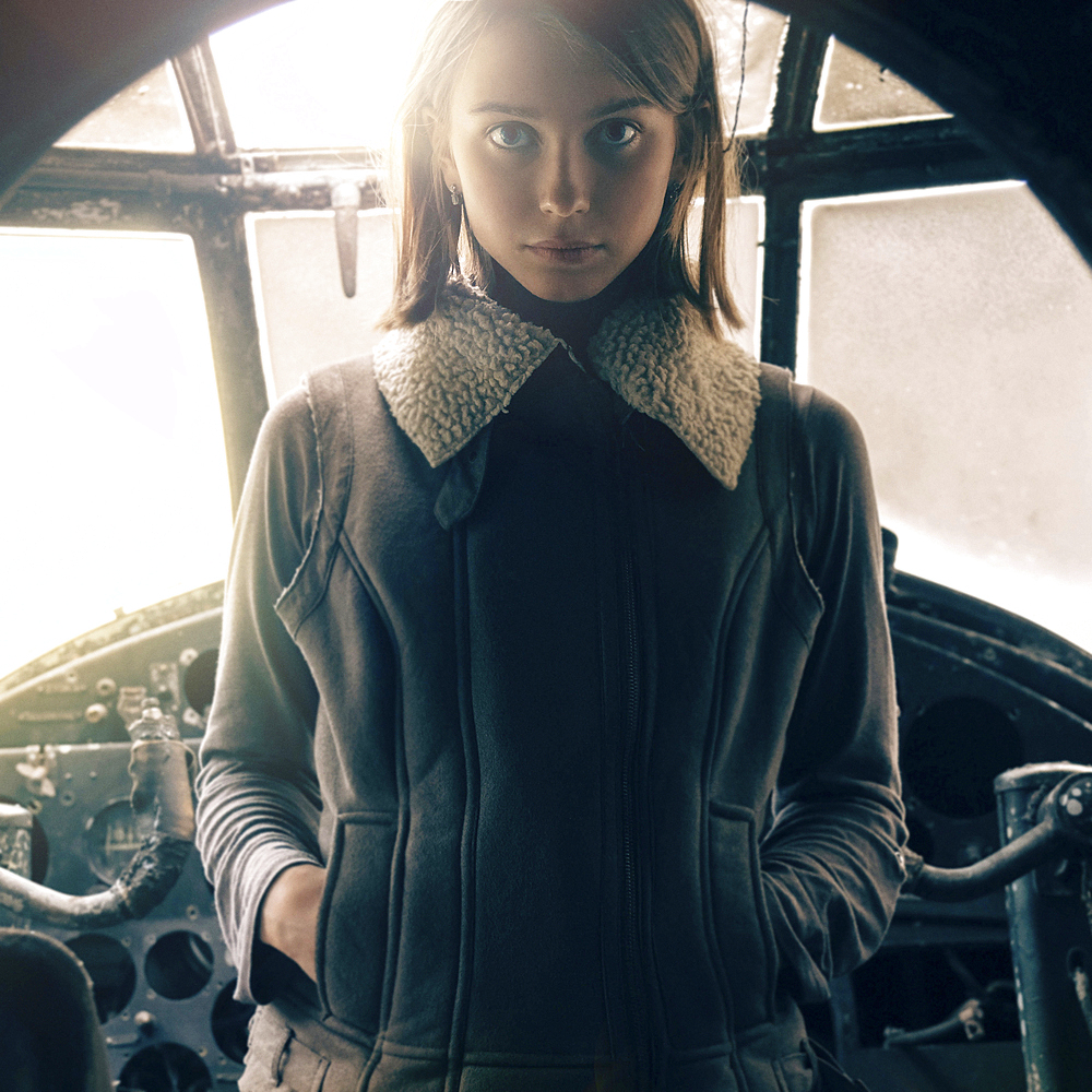 Caucasian woman standing in cockpit